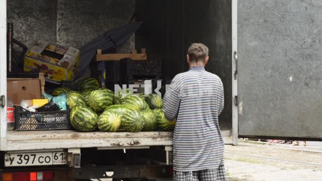 Men unload fruit from the body.
Men, movers, boxes, fruits, watermelons, grapes, truck, unload Men,...
