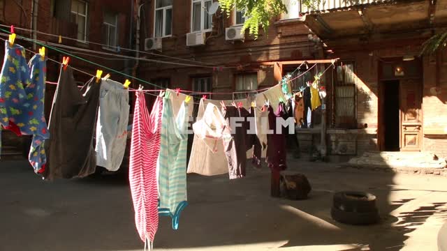 Clothes drying in the yard linen, yard, summer, clothespin, rope, road, sun, balcony, greenery,...