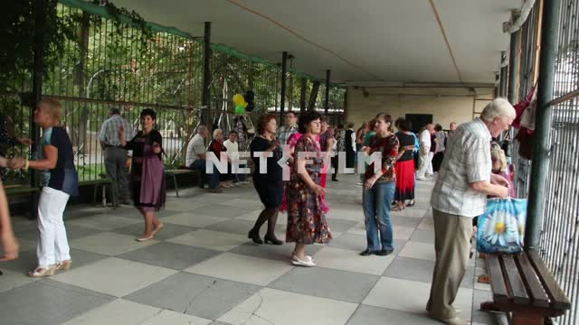 Elderly people dance on a summer Playground dance floor, for those who are over 30, dancing, women,...
