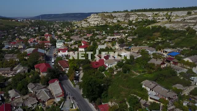 Aerial photo, survey copter, Bakhchisaray with the bird's eye view of houses with red roof.
In the...
