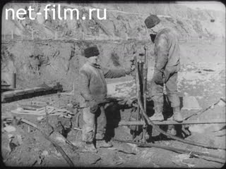 Footage Creek with two poles. (1920 - 1929)