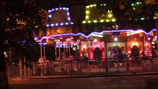 Carousel beautiful shimmering lights. Carousel, garland, lights, horses, night, working carousel