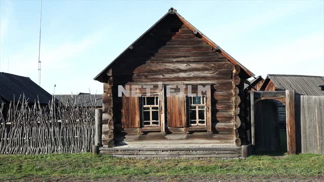 Rustic wooden house, rustic fence Rustic wooden house, rustic fence.
Real Russian village, the...