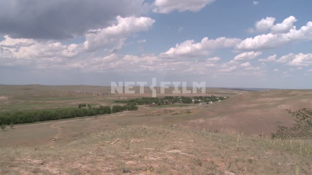 Landscape - steppe low mountains in the distance, beautiful sky , clouds Landscape - steppe low...