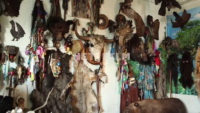 Wall with shamanic paraphernalia in the house of the shaman Wall with shamanic paraphernalia in the...