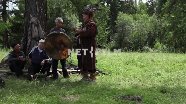 The Supreme shaman of Russia Dopchun Kara-ool, Tulasiewicz on the rite, ignites the fire, beats his...