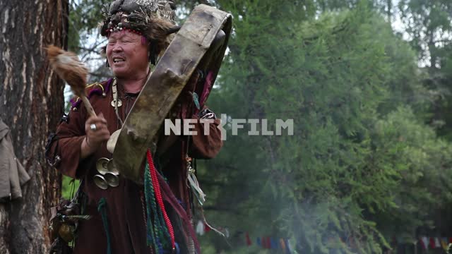 The Supreme shaman of Russia Dopchun Kara-ool, Tulasiewicz on the rite, beats the drum, People are...