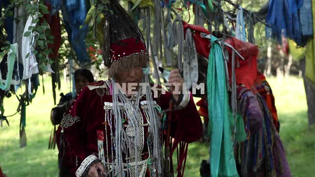 Colorful shaman with a pipe preparing for the ritual, Shamanism, Ethnography, religion, faith,...
