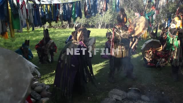 A shamanic ritual in a forest clearing, jewelry, charms.
Shamanism, faith, religion, Ethnography,...