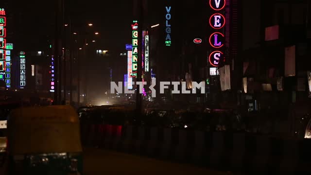 Neon signs in the evening the streets of the southern city Neon signs, evening street, city life,...
