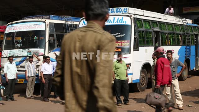 Men go around buses Men, buses, Hindus, transport