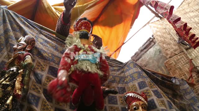 The puppeteer directs the two dolls in Indian puppet theatre puppets Puppet theatre, theatre of...