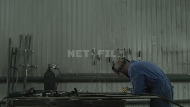 the welder assembles the metal frame.
Master, welder, welding, grinder, rod, needle, aluminum,...