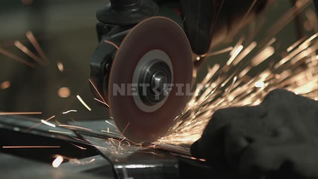 Close-up.
Man cuts a piece of thin rod with a grinder.
Master, welder, welding, angle grinder,...