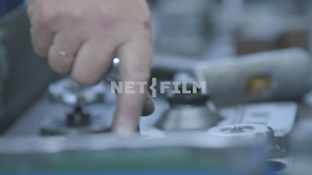Close-up, hand moves the lever of the machine.
Aircraft, aircraft factory, plant, workshop,...