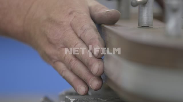 Hand holds metal parts close-up.
Hand, detail, pattern, checking, precision Hand, detail, pattern,...
