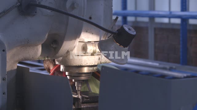 Worker grinds metal part.
Aircraft, factory, workshop, machine, detail, carve, mill, metal...