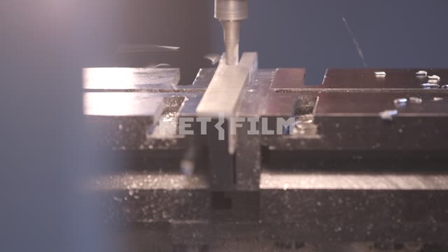 The machine grinds the metal part.
Aircraft, factory, workshop, machine, detail, carve, mill, metal...