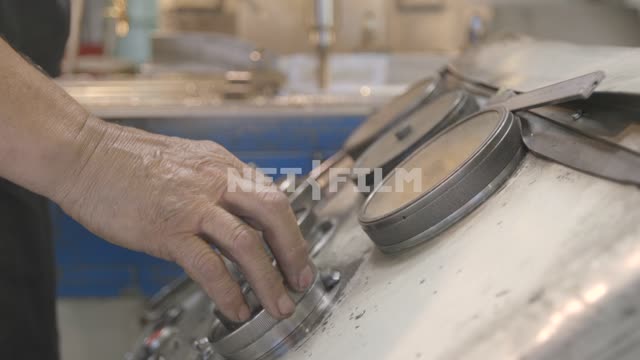 Close-up, Turner sets up the machine.
Mill, lathe, machine, detail, metal, shavings, metal...