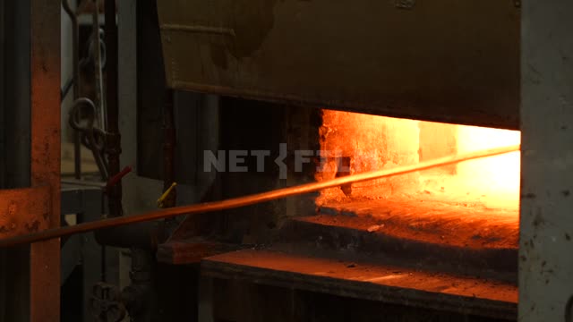 Caster with a fire iron in the blast furnace The foundry Plant the Foundry