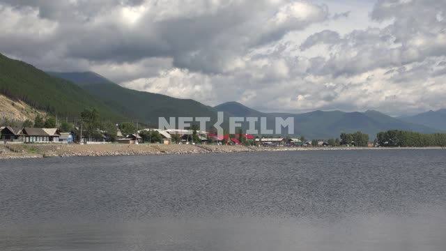 View of the village on the shore of lake Baikal - Nizhneangarsk, the most Northern settlement on...