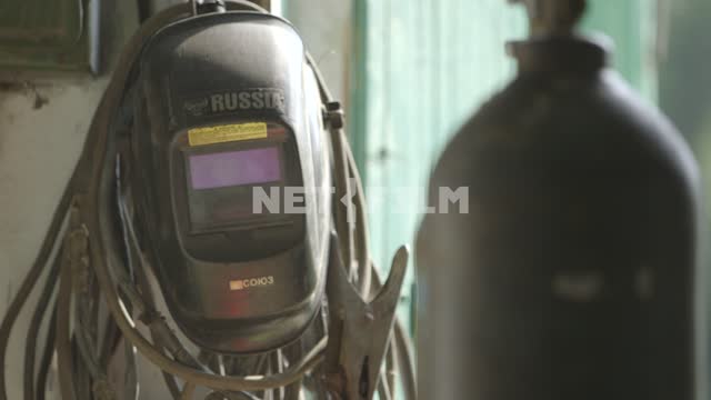 Mask of the welder with the inscription RUSSIA. Mask welder, welding, welder, gas tank, wires,...