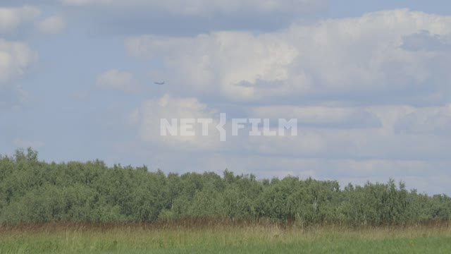 The plane climbs into the sky over the forest.
Sky, plane, forest, field, clouds, height, flight...