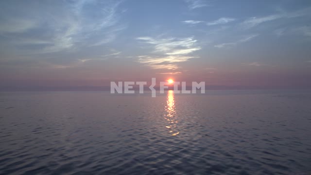 Summer sunset on the lake, view from moving boat Russia, Siberia, lake Baikal, wildlife, nature,...