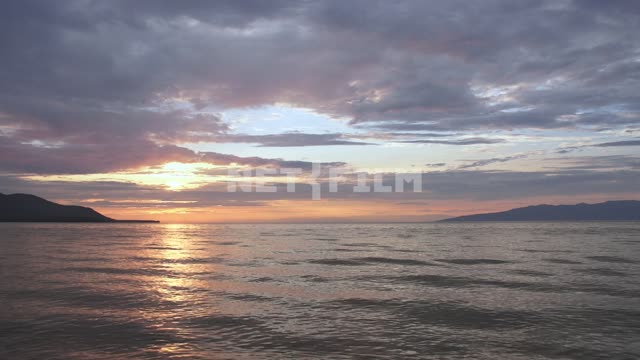 Sunset on the lake Russia, Siberia, Baikal, Buryatia, shore, coast, mountains, nature, landscape,...