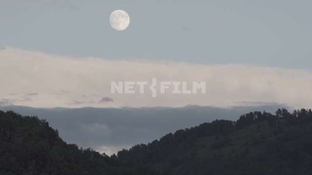 Full moon over the hills, twilight.
Field, meadow, road, forest, foothills, hill, mountains, moon,...