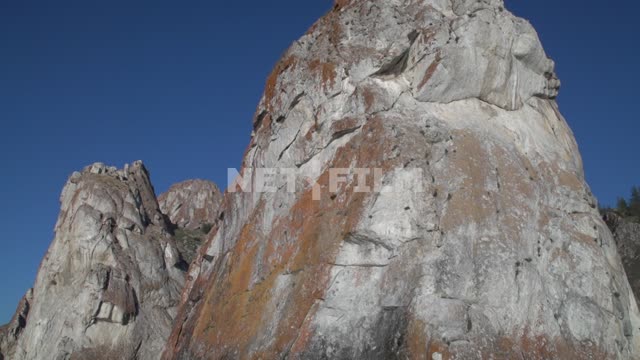 View from the boat on the rocky shore of the island of Olkhon, rock of white marble, covered with...