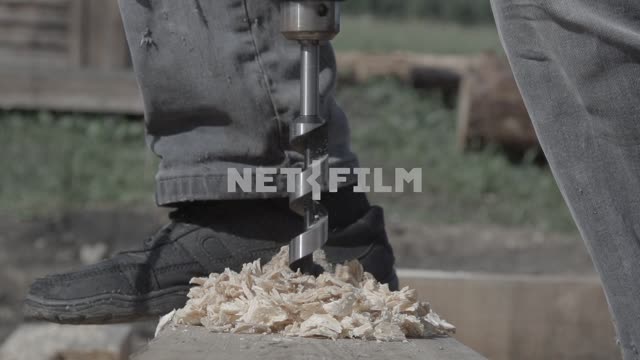 Cruny plan lapse drill drill lumber.
Close-up, slow motion, drill, drill, Board, wood, sawdust,...