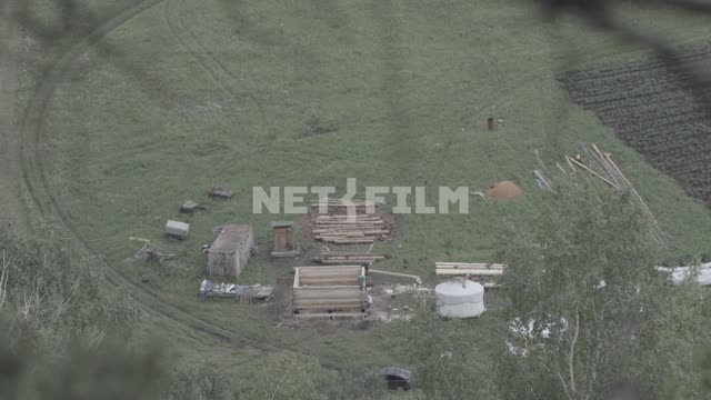 Top view of settlement in the field.
The field of construction, log, logs, lumber, construction,...