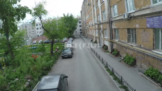 The camera runs through the archway into the deserted yard of the house.
Russia, Yekaterinburg,...