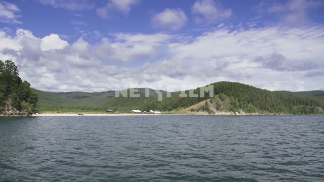 View from the boat on the shore of lake Baikal, summer landscape, village Russia, Siberia, Baikal,...