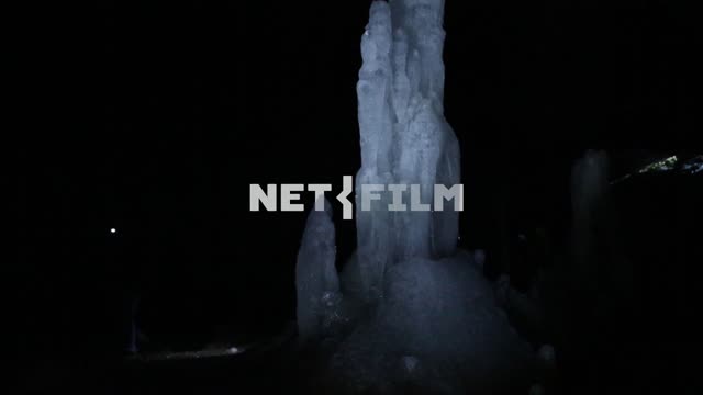 Askin cave, moving with lanterns in the dark, exploring stalagmites Ural, cave, stalagmites,...