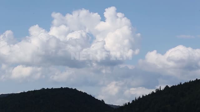 Nature of the Urals, mountains, forest on the slopes Mountains, forest, trees, clouds, nature