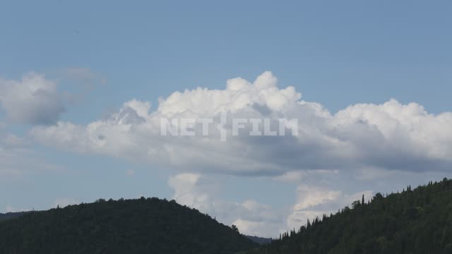 Nature of the Urals, mountains, forest on the slopes Mountains, forest, trees, clouds, nature,...
