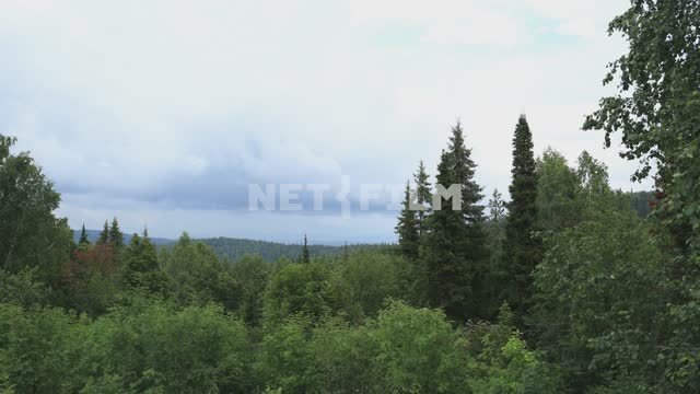 Nature of the Urals, mountains, forest on the slopes Mountains, forest, trees, clouds, clouds,...