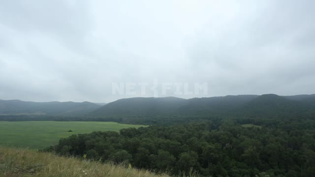 Nature of the Urals, panorama of a mountain valley Suleymanovo, mountains, hills, valley, meadow,...