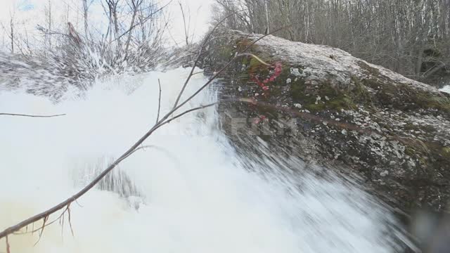 Kuk-Karauk waterfall, current, ribbons on shrub branches Ural, Ishimbaysky nature reserve,...