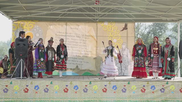 National holiday, folklore ensemble takes the stage, presentation of participants Ural, Salavatsky...