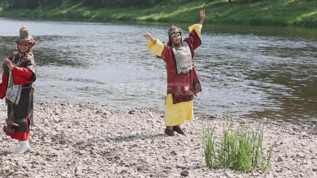Girls in national costumes rehearse on the river bank Ural, Salavatsky district, girls, national...