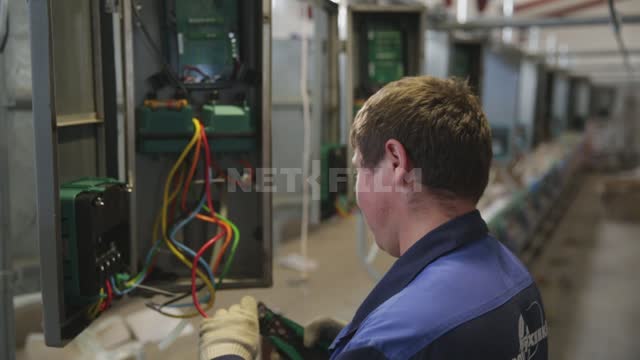 A worker checks the equipment, talks to the operator Ural, worker, master, specialist, man,...
