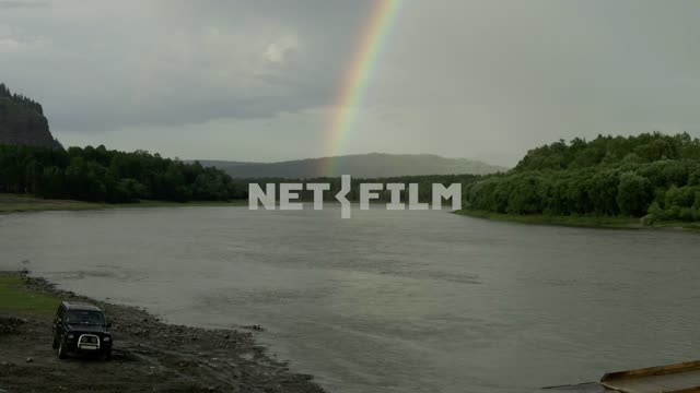 Rainbow over the river River, shore, car, trees, hills, nature, summer, day, light