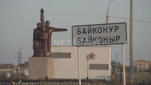 Entrance to the city and road sign Baikonur. Road...