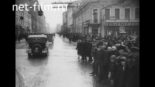Footage Government vehicles driving through the streets of Moscow. (1935)