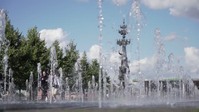 Monument to Peter the Great on the background of a fountain and running children Monument,...