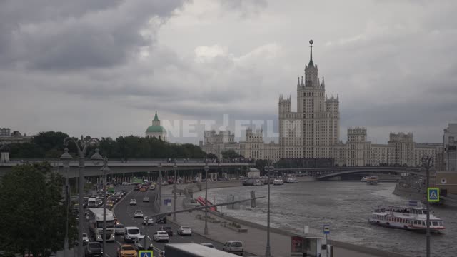 View of the Moskva River and a residential building on the Kotelnicheskaya embankment on a cloudy...