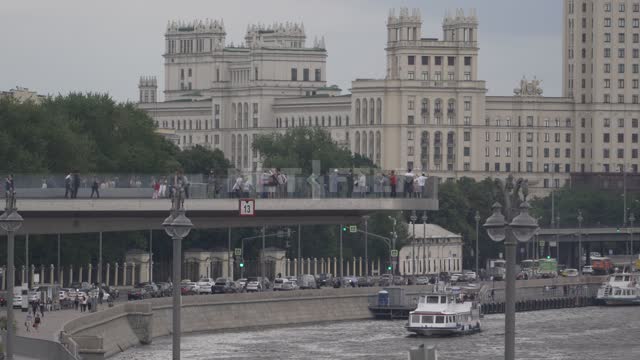 View of the Moskva River and a residential building on the Kotelnicheskaya embankment on a cloudy...